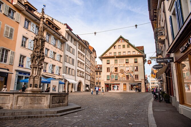 Discover Lucerne Guided Walking Tours - Torbogen Luzern: the train-station arch that survived a city-changing fire