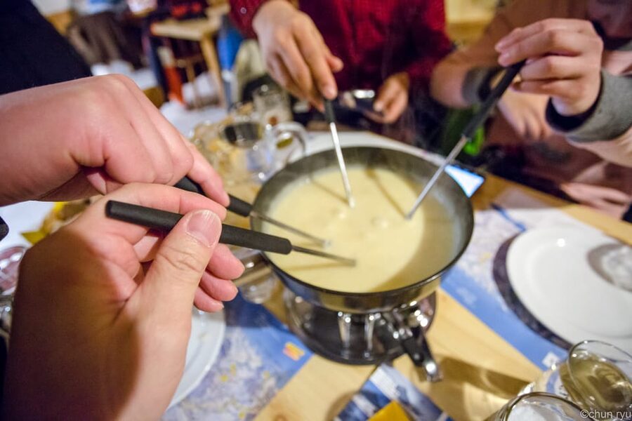 From Interlaken: Night Sledding with Cheese Fondue Dinner - Warming Up With Swiss Cheese Fondue And A Drink
