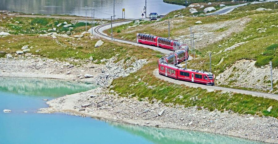 From Lake Como or Milan: Bernina Red Train Tour to St.Moritz - Windy weather and kitesurfing stunts around the resort lakes