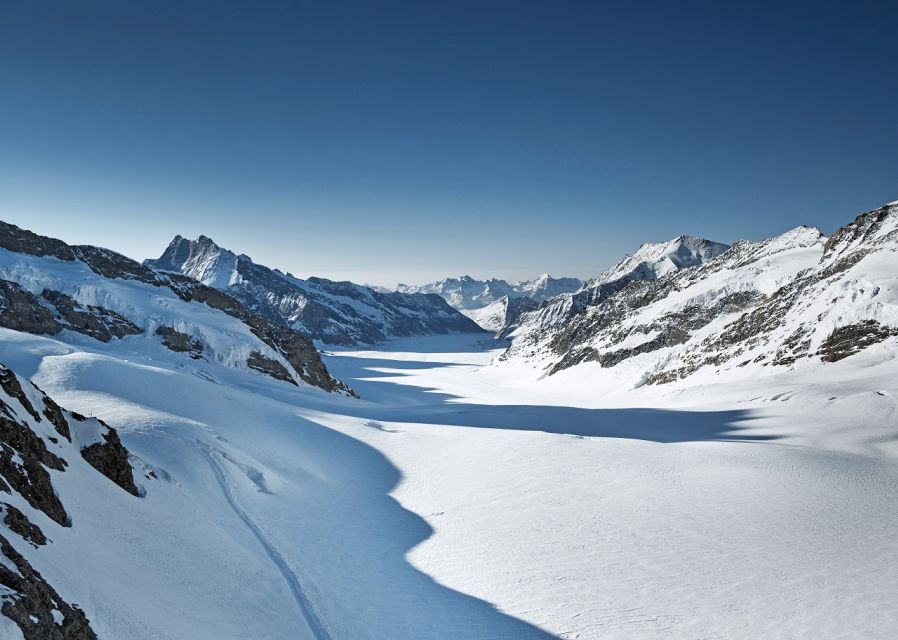 From Lucerne: Day Trip to Jungfraujoch - Top of Europe - Ice Palace tunnels and Alpine Sensation: doing more than looking