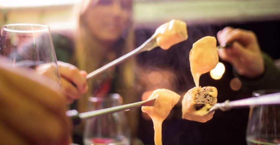 Geneva: tour with fondue and wine in TukTuk - The most memorable stop: fondue served where the city is