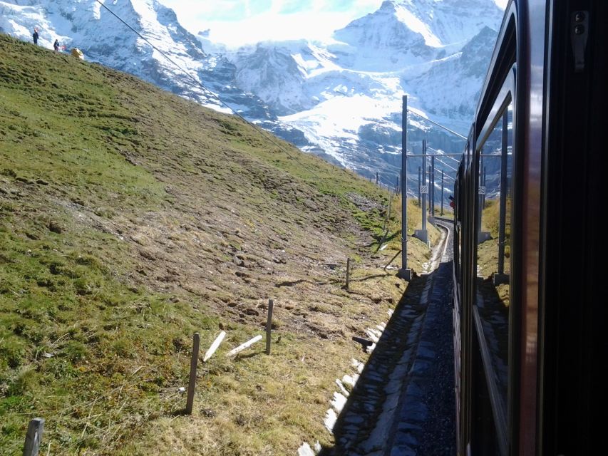 Jungfraujoch Top of Europe Private Day Trip from Bern - Jungfraujoch summit time: Sphinx Observatory, Ice Palace, and Alpine Sensation