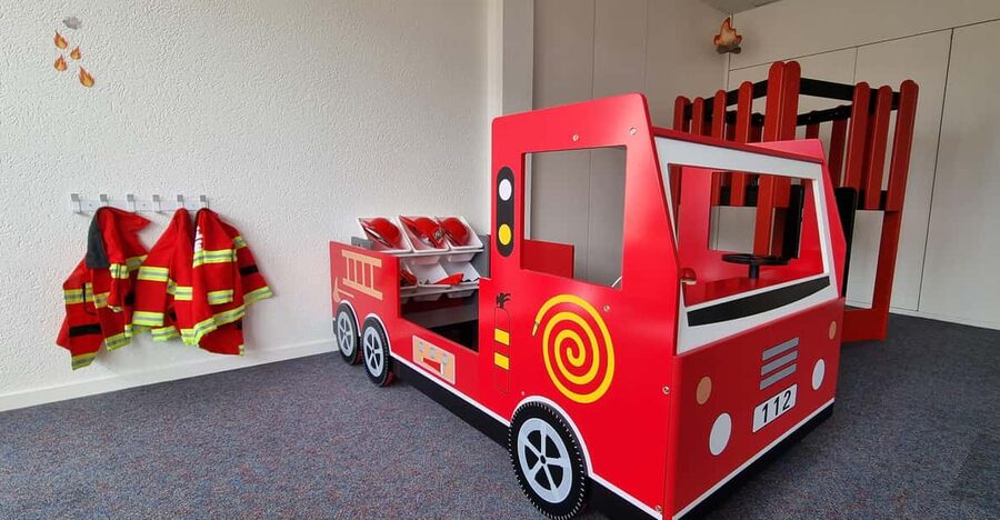 Play Village - Zurich's only Indoor Playground for Roleplay - Entering Play Village: the lift door detail and the Farmy Truck landmark