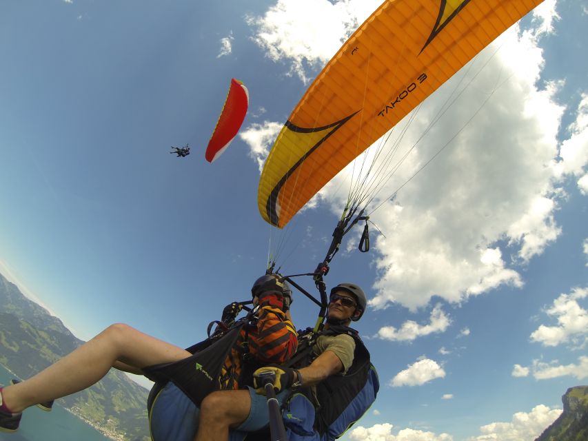 Stans: Tandem Paragliding Experience - Landing Back in the Valley and Getting Returned to the Station