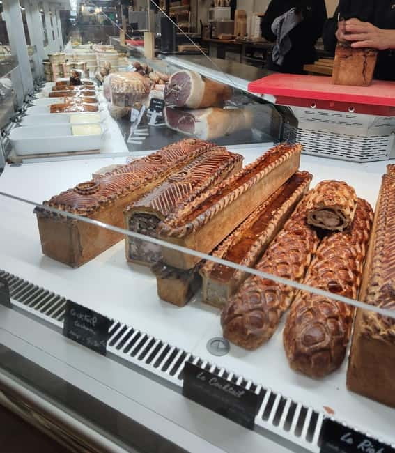 Taste Geneva: Exclusive Walking Food Tour with Full Meal - The Geneva covered market stop for charcuterie you can taste slowly