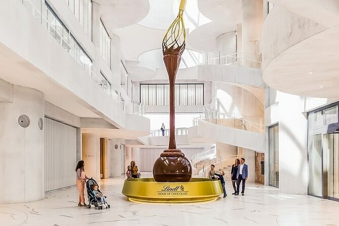 Tour in Lindt Home of Chocolate Museum From Zurich - The tasting room with unlimited chocolate, plus the store effect
