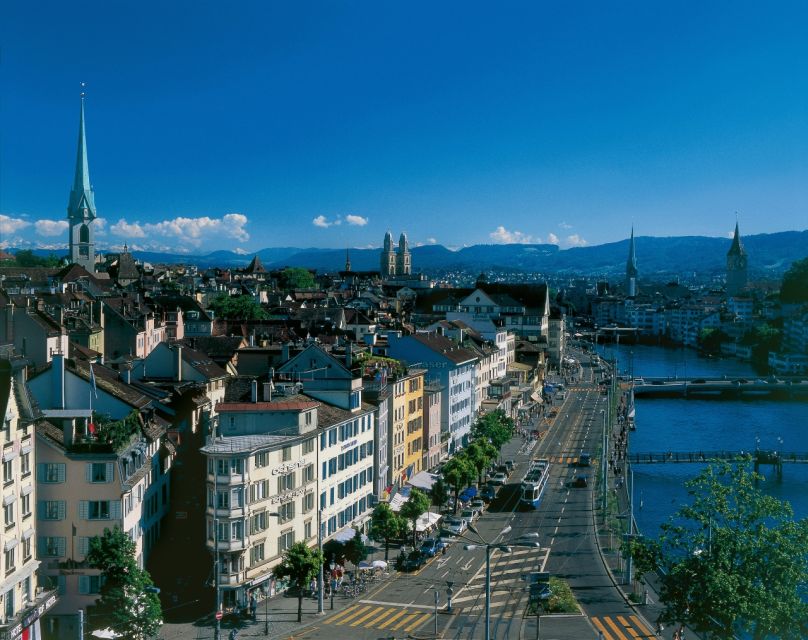 Zurich: City Top Attractions Tour by Bus with Audio Guide - Waterfront and mountain views: the lake moment you will want to remember