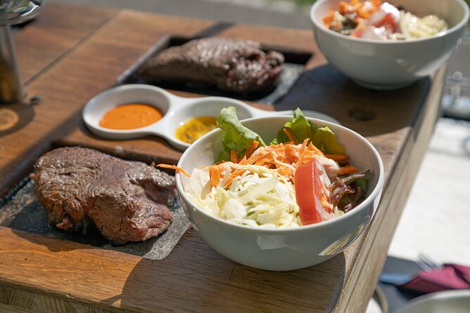 Zürich eTukTuk Tour - Hot Stone BBQ and Wine - Price and value: $185.42 buys transport plus a real meal