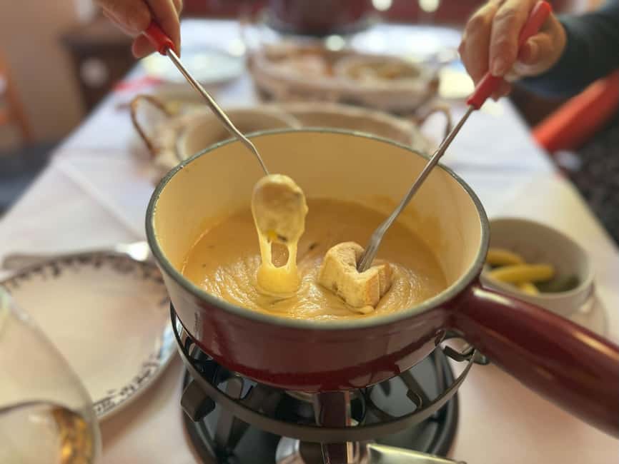 Zurich: Food Tour of 8+ Tastings with Cheeses & Chocolates - Rösti with creamy meat stew and local Riesling wine